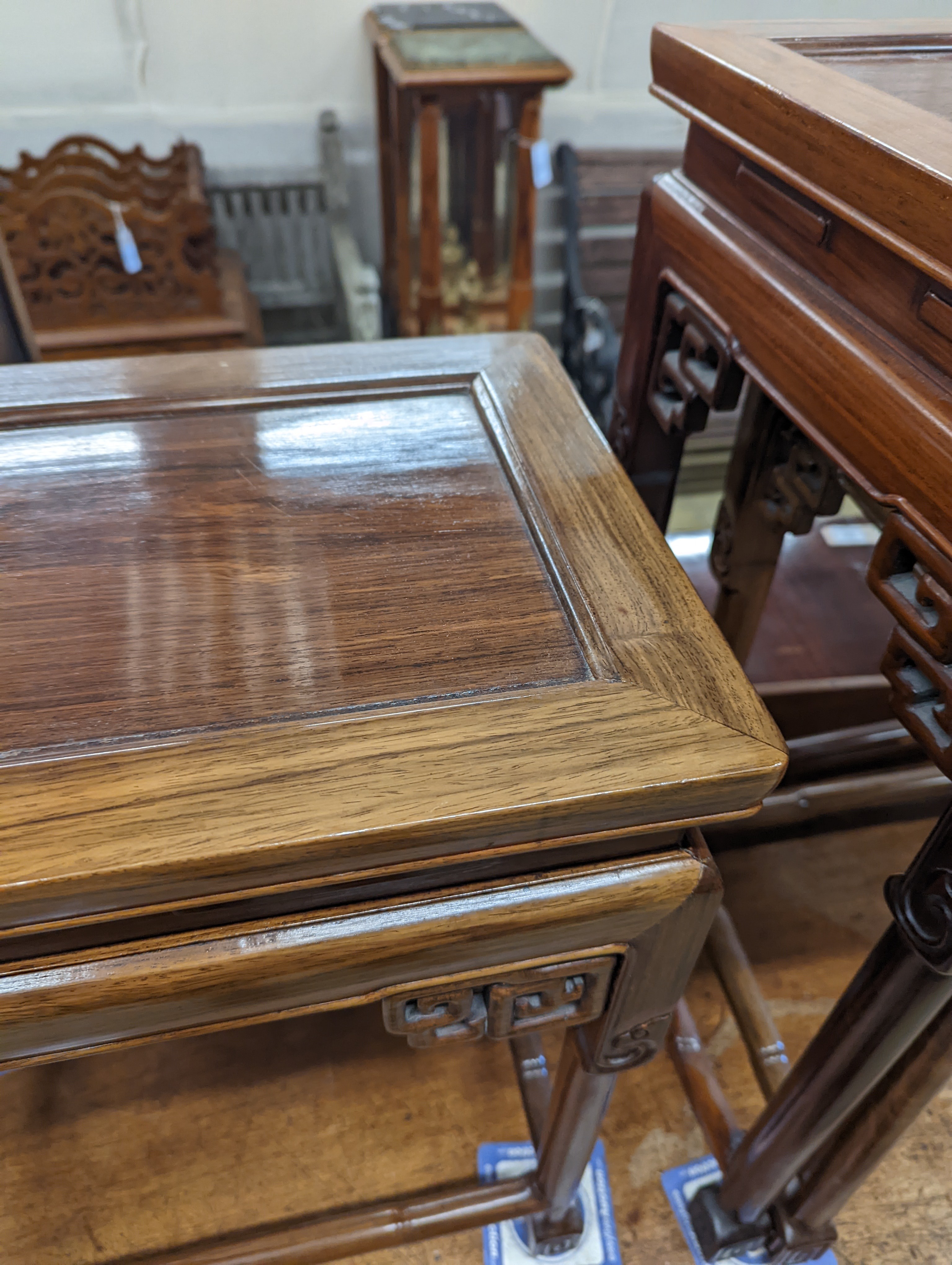 A nest of three Chinese rectangular tea tables, width 61cm, depth 36cm, height 66cm